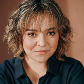 Headshot of Alexis Sears wearing black.